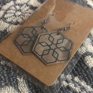 Homemade wooden earrings.  Snowflake green